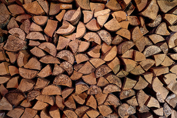 Wooden logs, beams, firewood, frame. A lot of wood. Wooden log wooden background. Logging