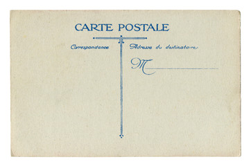 Back of historical French postcard: blank card with correspondence and address boxes on grey-brown old paper with blue lines,  the beginning of the 20th century. France