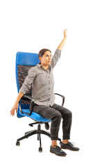 Woman sitting on the office chair and doing exercises.