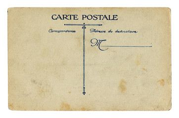 Back of historical French postcard: blank card with correspondence and address boxes on brown old paper with spots, the beginning of the 20th century. France