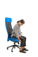 Woman who adjusts his ergonomic chair in the office