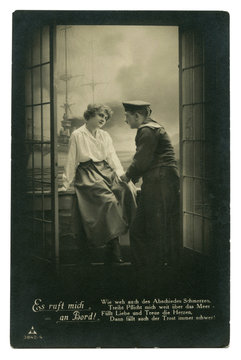 Old German postcard: Photo: couple in love: sailor and girl on the balcony on the background of a warship at sea. romantic date. world war I 1914-1918, Germany