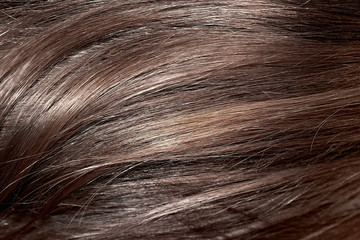 Brown hair as background, texture. One of the popular shades of hair coloring