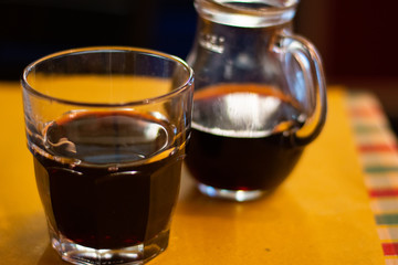 Red Wine In A Glass And Carafe On A Restaurant Table In Rome, Italy.