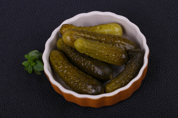 Pickled cucumbers heap in the bowl
