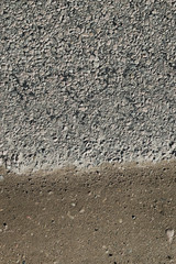 Road with a lot of cracked asphalt parts together next to ground
