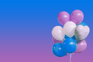 Bunch of colorful pink, blue and white balloons isolated on white background