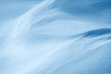 Fresh snow background texture. Winter background with snowflakes and snow mounds. Snow lumps.