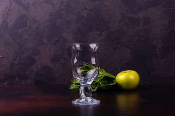 Ginger green apple smoothie on concrete background. It can be used as a background