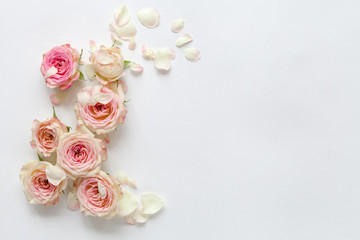 White woman background with roses. Top view.