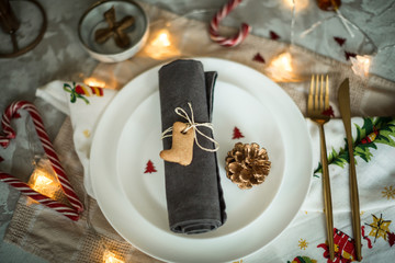 table setting for dinner at christmas