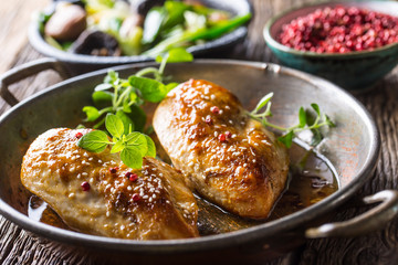 Roasted chicken breast sesame oregano and pepper in pan
