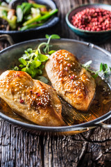 Roasted chicken breast sesame oregano and pepper in pan