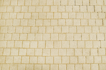 Beige stone pavement background texture