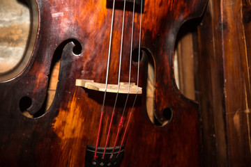 Vintage contrabass on wooden floor © fotosr52