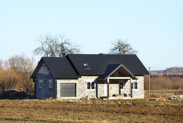 Obraz premium The project of a modern villa. Project of a small villa with clear walls and a brown roof. Rear and front courtyard of a private territory. Mastering new land and building