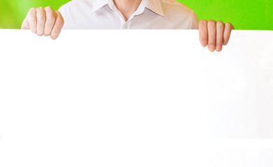 close up of man hands showing white blank board