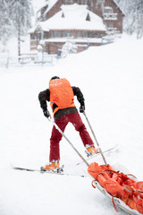 Ski rescue in the mountains