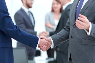 concept of cooperation.handshake of business partners