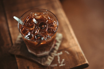Brown Coffee | Milk coffee glass on the brown wooden table background | Vietnamese coffee style