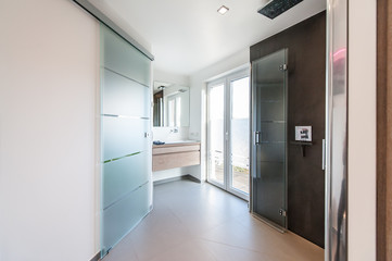 Modern bathroom with glass doors