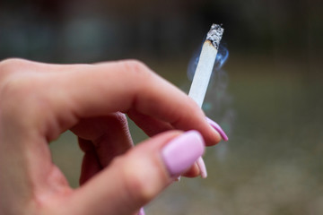 Young woman enjoying a cigarette