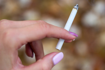 Young woman enjoying a cigarette