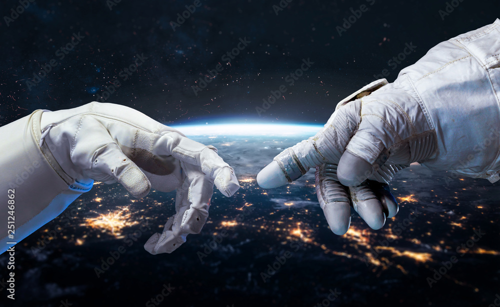 Poster Astronaut and robot hands in the space. Earth planet on the background. Communication and technology. Cities lights. Elements of this image furnished by NASA