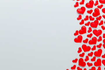 Happy Valentines day background. With small hearts on pastel background.
