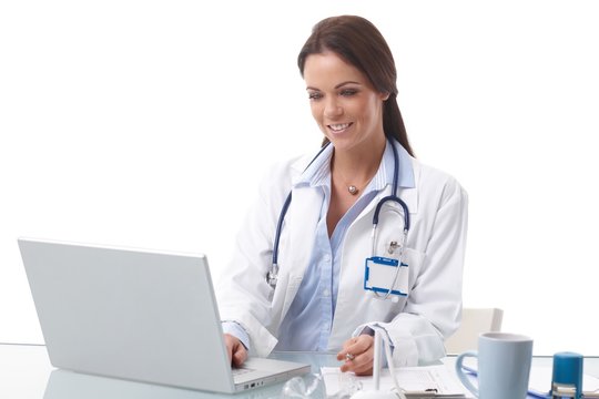 Female doctor working at desk