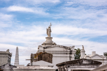 Fototapeta na wymiar Beautiful above ground graves in the famous St. Louis Cemetery Number 1 in New Orleans, Louisiana, site of the grave of Marie Laveau, Vodoo Queen.