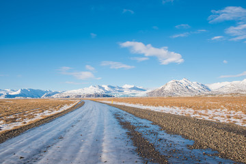 Iced gravel road on the icelandic countryside