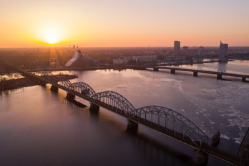 A view of the Railway Bridge over Daugava River during Sunset in Riga, Latvia