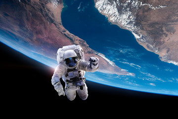 Astronaut in outer space on orbit of the Earth. Elements of this image furnished by NASA