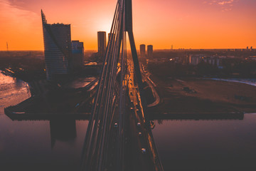 Aerial view of the Riga, the capital of Latvia with suspension bridge across Daugava River in Europe