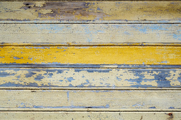 blue and yellow horizontal wooden wall background, multicolored surface with cracked paint, vintage backdrop