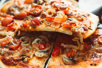 Home made pizza with shallow depth of field. Vintage style and instagram filter.