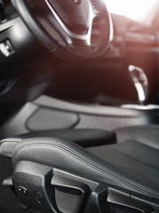 Obraz premium Dark luxury car Interior. steering wheel, shift lever and dashboard.