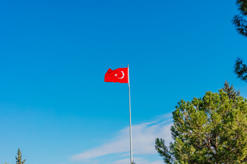 Turkish flag waving at blue sky. Turkey country flag flowing in the wind at blue sky. 