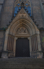 Faсade of gothic cathedral with beautiful door and window