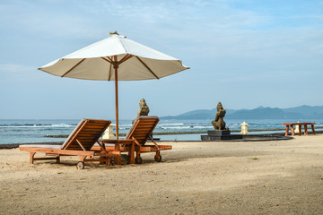 Beach lounge chairs with umbrella
