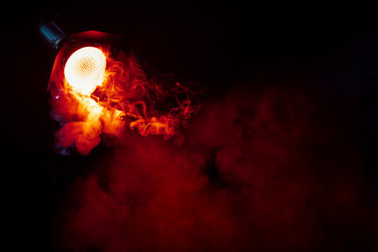 Red light with smoke in the dark. Equipment for photo Studio.