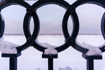 fragment of the iron fence of the winter quay