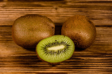 Ripe kiwi fruits on a wooden table