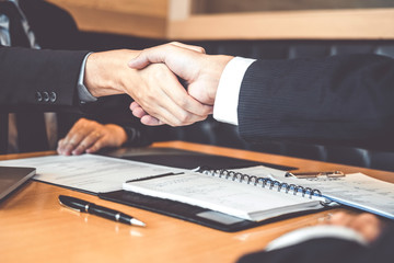 Shaking hands Business people greeting new colleagues while job interviewing shaking hands meeting Planning after during job interview Concept