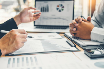 Consulting  Co-working Business Team meeting Planning Strategy Analysis investment and saving concept. meeting discussing new plan financial graph data.