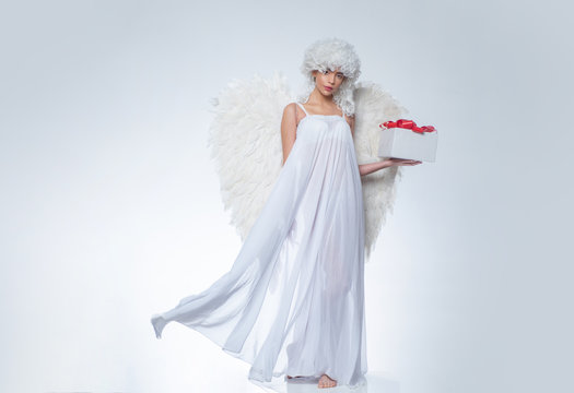 Valentines Day symbol. Angel woman with wings isolated. Art photo of a Angelic beautiful woman.