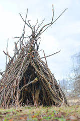 hut made of old branches - the decoration of the garden in landscape design