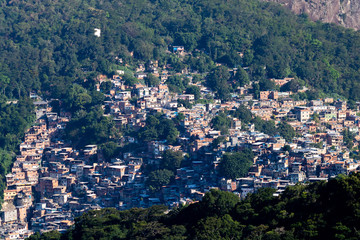 Fototapeta premium Aerial view of Favela da Rocinha, Biggest Slum in Brazil on the Two Brothers Mountain in Rio de Janeiro