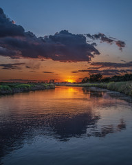 Fototapeta na wymiar Sunset on the river canal